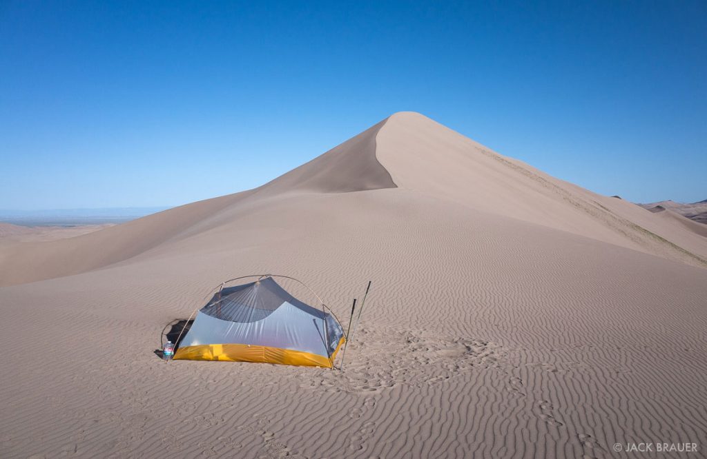 put up a tent in the sand